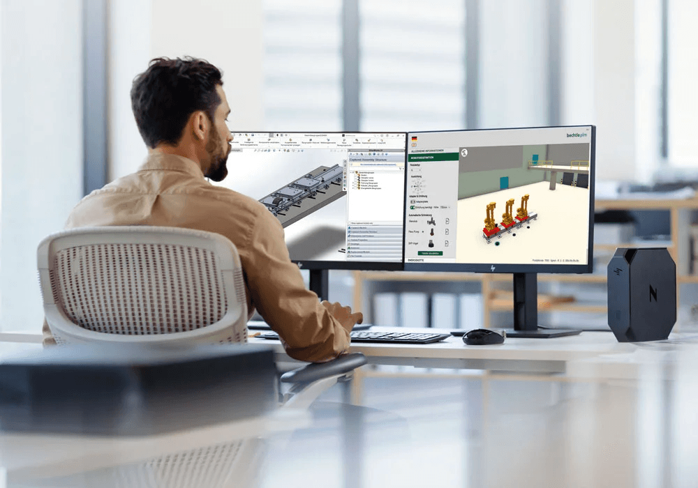Mann am Arbeitsplatz – CAD-Automatisierung Ein Mann arbeitet an einem CAD-System mit Fokus auf Automatisierungsprozesse