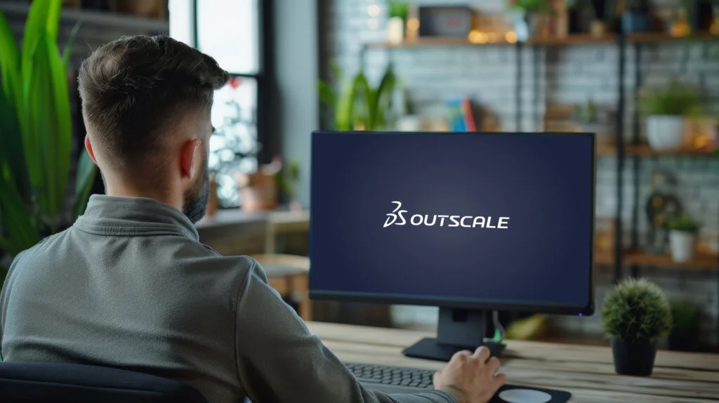 Person arbeitet an einem PC mit Outscale DS Systemen